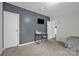 Bedroom with gray walls, desk, and TV, providing a workspace and entertainment at 151 Brown Farms Dr, Cleveland, NC 27013