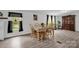 Charming dining room featuring a wood table, chairs, hardwood floors, and natural light from large windows at 151 Brown Farms Dr, Cleveland, NC 27013