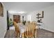Bright dining area with wood table and chairs, hardwood floors, and a display cabinet at 151 Brown Farms Dr, Cleveland, NC 27013