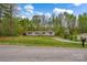 Charming single-story home with a well-maintained lawn and surrounded by lush trees at 151 Brown Farms Dr, Cleveland, NC 27013