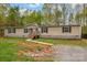 Inviting single-story home features a cozy front porch and meticulous landscaping at 151 Brown Farms Dr, Cleveland, NC 27013