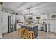 Modern kitchen with stainless steel appliances, a spacious island, and bright white cabinets at 151 Brown Farms Dr, Cleveland, NC 27013