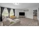 Bright living room with a comfortable sectional, a large window, and modern flooring at 151 Brown Farms Dr, Cleveland, NC 27013