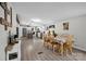Open living space with an island kitchen, wood table, and chairs, and hardwood floors at 151 Brown Farms Dr, Cleveland, NC 27013