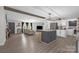 Open concept living space featuring an island, lots of windows, and modern flooring at 151 Brown Farms Dr, Cleveland, NC 27013