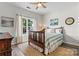 Inviting bedroom features wood floors, a large window, and neutral tones offering a calming atmosphere at 158 Bluffton Rd, Mooresville, NC 28115