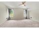 Spacious bonus room features plush carpeting and ample natural light, creating a versatile and inviting space at 158 Bluffton Rd, Mooresville, NC 28115