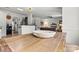 View of dining area and kitchen featuring wood table and a woven bowl centerpiece at 158 Bluffton Rd, Mooresville, NC 28115
