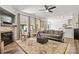 Bright living room with hardwood flooring, a stone fireplace, and an open floor plan to the dining area at 158 Bluffton Rd, Mooresville, NC 28115