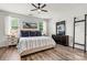 Serene main bedroom with coastal-inspired decor, fan, and great natural light at 158 Bluffton Rd, Mooresville, NC 28115