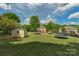 Expansive backyard featuring a shed, trampoline, and lush lawn, perfect for outdoor activities and relaxation at 1614 Crestgate Dr, Waxhaw, NC 28173