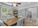 Formal dining room boasts natural light, decorative ceiling fan, and ample space for entertaining at 1614 Crestgate Dr, Waxhaw, NC 28173