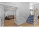 Inviting foyer with hardwood floors, staircase, and doorway to the cozy living room at 1614 Crestgate Dr, Waxhaw, NC 28173
