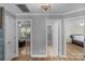 Hallway leading to bedroom and bathroom with light streaming in from the window at 1614 Crestgate Dr, Waxhaw, NC 28173