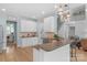 Stylish kitchen with modern appliances and open view to the staircase at 1614 Crestgate Dr, Waxhaw, NC 28173