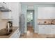 Well-lit kitchen with stainless steel appliances and white cabinets at 1614 Crestgate Dr, Waxhaw, NC 28173