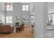 Spacious living room features hardwood floors, a fireplace, and lots of natural light at 1614 Crestgate Dr, Waxhaw, NC 28173