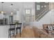 Open-concept living space with hardwood floors and adjacent kitchen area at 1614 Crestgate Dr, Waxhaw, NC 28173