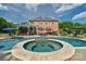 A pristine swimming pool with attached spa and lounge chairs provides an oasis for relaxation and outdoor entertainment at 1614 Crestgate Dr, Waxhaw, NC 28173