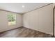 Empty bedroom featuring wood laminate flooring and a sunlit window at 1649 Cloudburst Cir # 6, Lincolnton, NC 28092