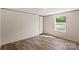 Bedroom with plank flooring and natural light from window at 1649 Cloudburst Cir # 6, Lincolnton, NC 28092