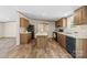 Modern kitchen with center island, wood cabinets, and stylish flooring for a contemporary feel at 1649 Cloudburst Cir # 6, Lincolnton, NC 28092