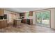 Modern kitchen with center island, wood cabinets, stainless appliances, and access to the deck at 1649 Cloudburst Cir # 6, Lincolnton, NC 28092