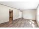 Large open living room boasts plank flooring and doorways to bathroom and other rooms at 1649 Cloudburst Cir # 6, Lincolnton, NC 28092