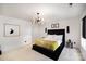 Bright bedroom featuring a black paneled bed, modern lighting, and contemporary decor at 1911 Almond Hills Dr, Charlotte, NC 28262