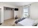 Bright bedroom with a large window, closet and natural light streaming through sheer curtains at 1911 Almond Hills Dr, Charlotte, NC 28262