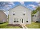 A charming two-story home with vinyl siding, a manicured front lawn, and a inviting entrance at 1911 Almond Hills Dr, Charlotte, NC 28262