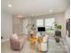 Cozy living room featuring stylish chairs, modern desk, and natural light at 1911 Almond Hills Dr, Charlotte, NC 28262