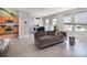 Inviting living room that opens to the kitchen and dining area, with many windows at 1911 Almond Hills Dr, Charlotte, NC 28262