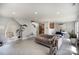 Bright living room featuring an open floor plan that connects to kitchen and dining room at 1911 Almond Hills Dr, Charlotte, NC 28262