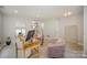 Open living room with contemporary desk, comfortable chairs, and modern décor at 1911 Almond Hills Dr, Charlotte, NC 28262
