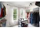 Bright walk-in closet with double windows and ample storage for clothing and accessories at 1911 Almond Hills Dr, Charlotte, NC 28262