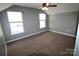 Bedroom with neutral walls, carpet floors, with multiple windows offering natural light and a ceiling fan at 2043 Shady Pond Dr, Clover, SC 29710