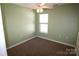 Clean bedroom features neutral walls, carpet, and a window at 2043 Shady Pond Dr, Clover, SC 29710