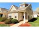 Charming townhouse featuring a tidy front lawn, tan siding, and a welcoming front entrance with address number at 2043 Shady Pond Dr, Clover, SC 29710