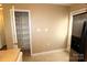 View of pantry with white shelves with stainless steel refrigerator adjacent to it at 2043 Shady Pond Dr, Clover, SC 29710