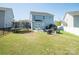 Large backyard featuring a patio area, a trampoline, and ample space for recreational activities at 2207 Atwell Glen Ln, Pineville, NC 28134