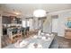 The dining area leads to the staircase and modern kitchen with counter seating at 2207 Atwell Glen Ln, Pineville, NC 28134