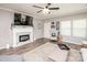 Modern living room featuring a fireplace, stylish decor, and plenty of natural light at 2207 Atwell Glen Ln, Pineville, NC 28134