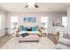Comfortable living room with area rug, neutral paint, and decorative artwork at 2207 Atwell Glen Ln, Pineville, NC 28134