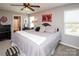 Inviting main bedroom with ensuite bathroom and ample closet space, ceiling fan, and carpeted floor at 2207 Atwell Glen Ln, Pineville, NC 28134