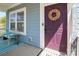 A cozy front porch offers a comfortable spot to sit and enjoy the neighborhood view at 2207 Atwell Glen Ln, Pineville, NC 28134