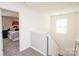 Upstairs landing with view into bedroom and carpeted floors at 2207 Atwell Glen Ln, Pineville, NC 28134