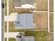 Aerial view of a gray home with a large fenced-in backyard, patio, and driveway at 228 Brownstone Dr, Rock Hill, SC 29730