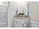 Clean, well-lit bathroom with a modern vanity, granite countertop, and a tiled shower at 228 Brownstone Dr, Rock Hill, SC 29730