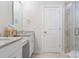 Bright bathroom features dual sinks with granite countertops and a glass enclosed shower at 228 Brownstone Dr, Rock Hill, SC 29730